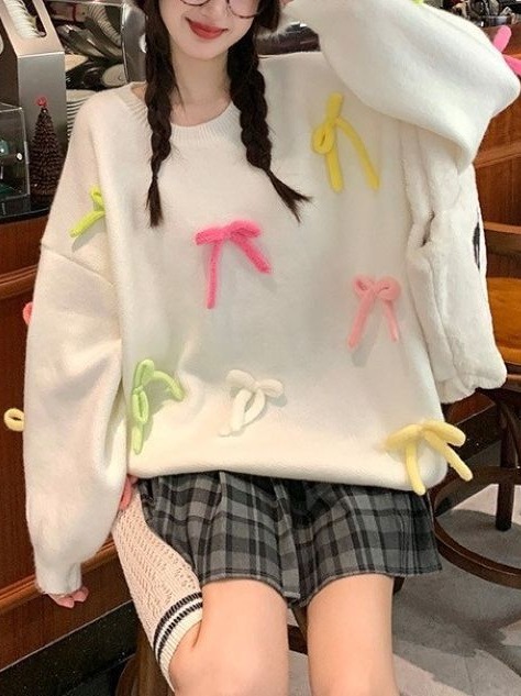 2023 suéter suelto de dopamina Otoño e Invierno chica dulce desgaste arco tridimensional diseño nicho reducción de la edad de punto top