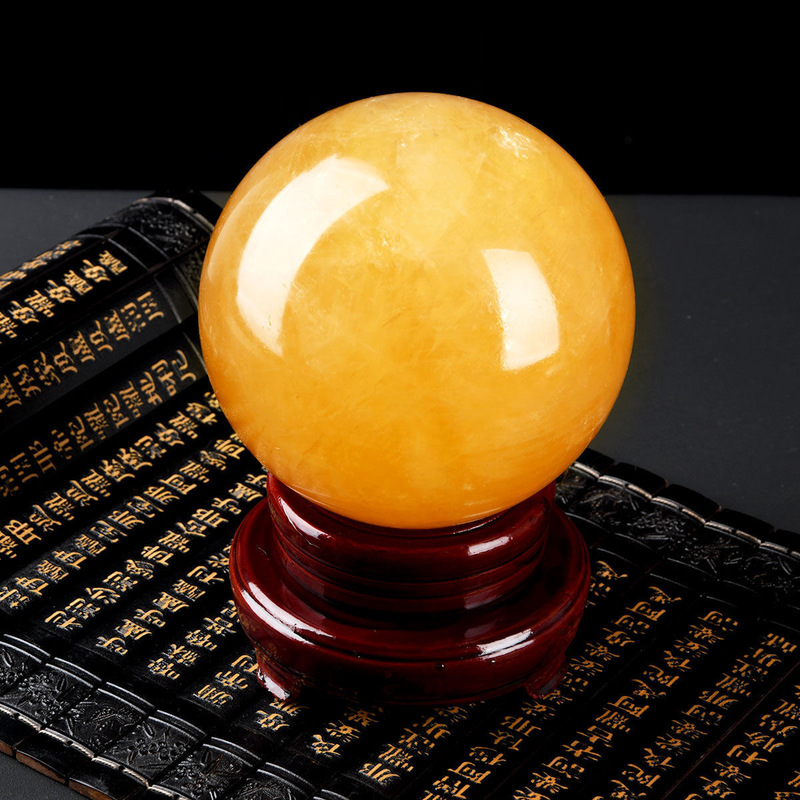 Factory for natural raw stone polished natural yellow crystal ball ornaments calcite Iceland stone ornaments wholesale