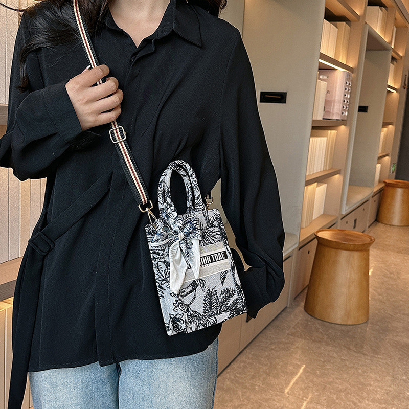 Bolso pequeño para mujer, nuevo bolso de mano vertical personalizado de moda europea y americana, bolso cruzado con estampado de lona de nicho