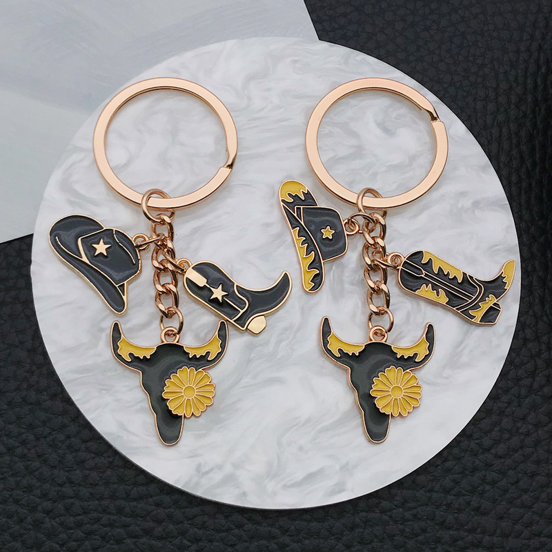 Cross-border personality European and American jewelry oil black denim with star hat boots cow's head alloy keychain wholesale