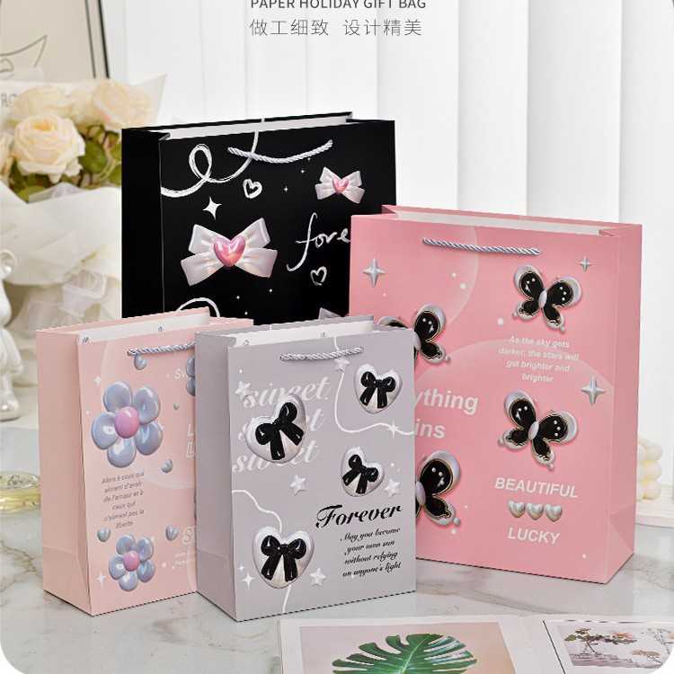 新款甜美粉色蝴蝶结礼品袋创意时尚白卡纸手提袋节日派对伴手礼袋