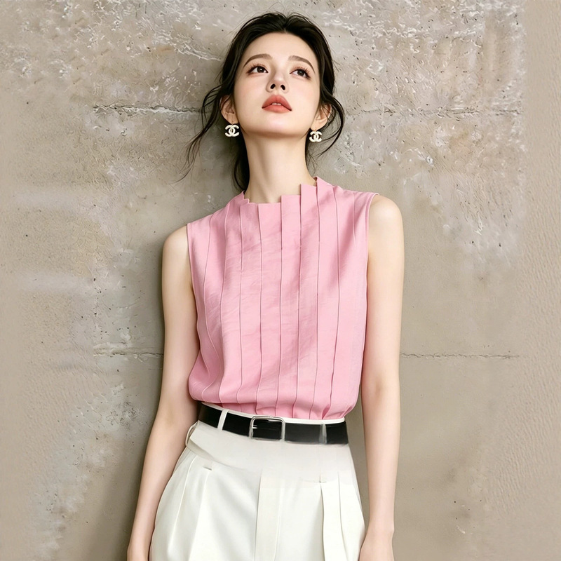 Extremely beautiful, unique, and stylish, this bright pink sleeveless shirt with an accordion pleat design and a stand-up collar is a youthful and fashionable summer top