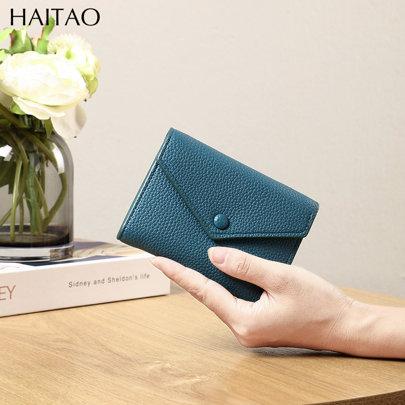 Cartera de mujer corta simple cartera plegable de tres pliegues japonesa y coreana de moda nuevo sobre bolso de cambio transfronterizo