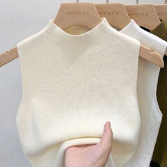 中にニットのセーターを着て、女性の春の新型の半高襟のキャミソールの短いタイプの外に袖なしの上着を着ます。