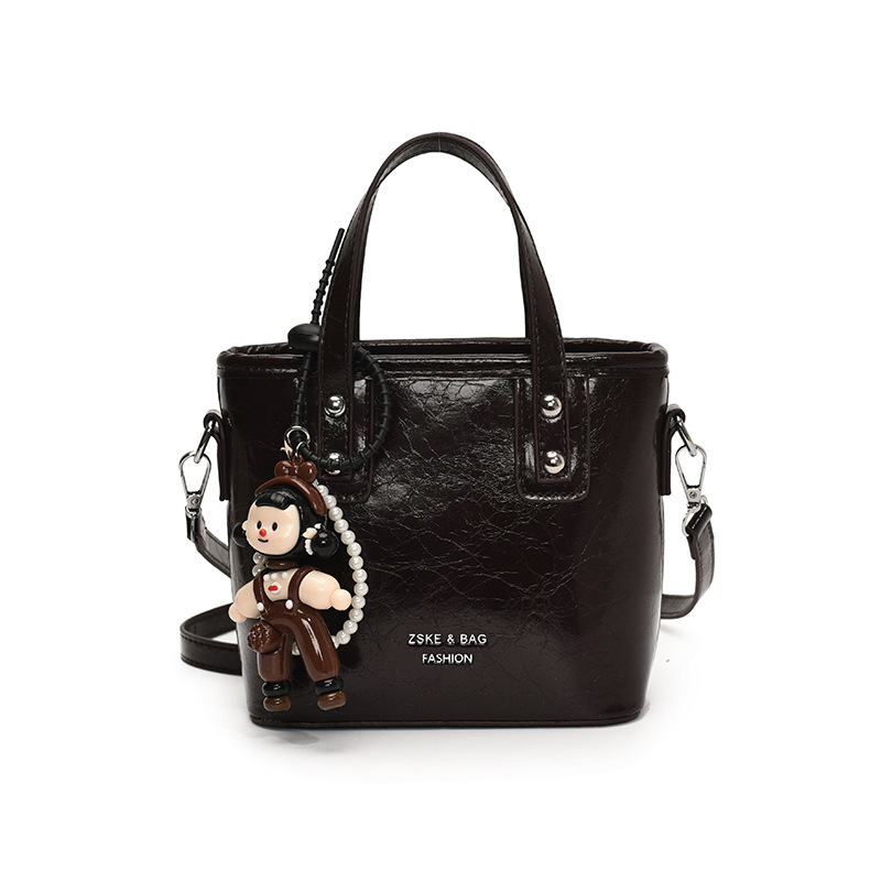 2025 nuevo nicho de moda bolso de cubo de mano para mujeres estilo coreano simple versátil bolso de hombro de moda mochila casual