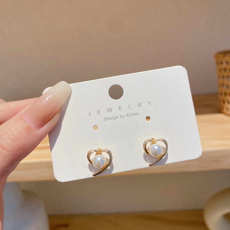 Pendientes de perlas, pendientes de estilo caliente, lujo ligero, pendientes simples de celebridades de Internet, accesorios de Yiwu, venta al por mayor