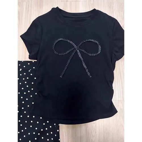 A stylish summer outfit set featuring a bow tie T-shirt top, polka dot mini skirt, and a slimming, youthful, and trendy women's set.