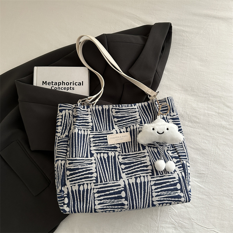 Bolso a rayas casual de todos los partidos de nicho para mujer 2024 nuevo bolso de hombro de gran capacidad de moda retro bolso de viaje