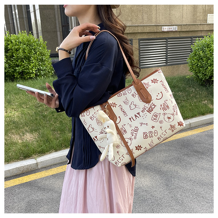 Bolso grande bolso de mujer 2025 nuevo lindo cartón pu bolso de hombro con cremallera de moda bolsa de otoño / invierno bolso de mujer