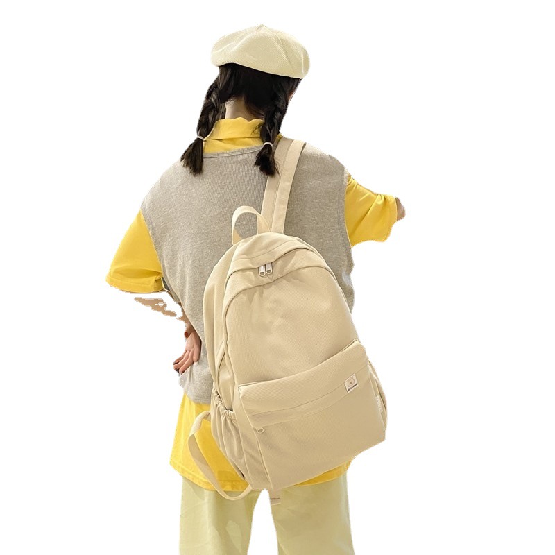 Dulce chica suave color sólido gran capacidad estudiante mochila 2023 otoño nuevo estudiante universitario ins mochila al por mayor
