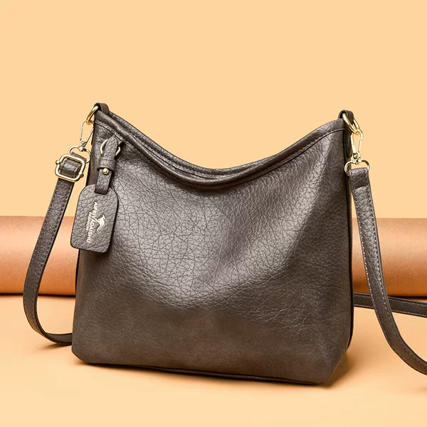 Cross-border casual style genuine leather bucket bag with pendant, vintage leather practical women's bag, new versatile shoulder and crossbody bag