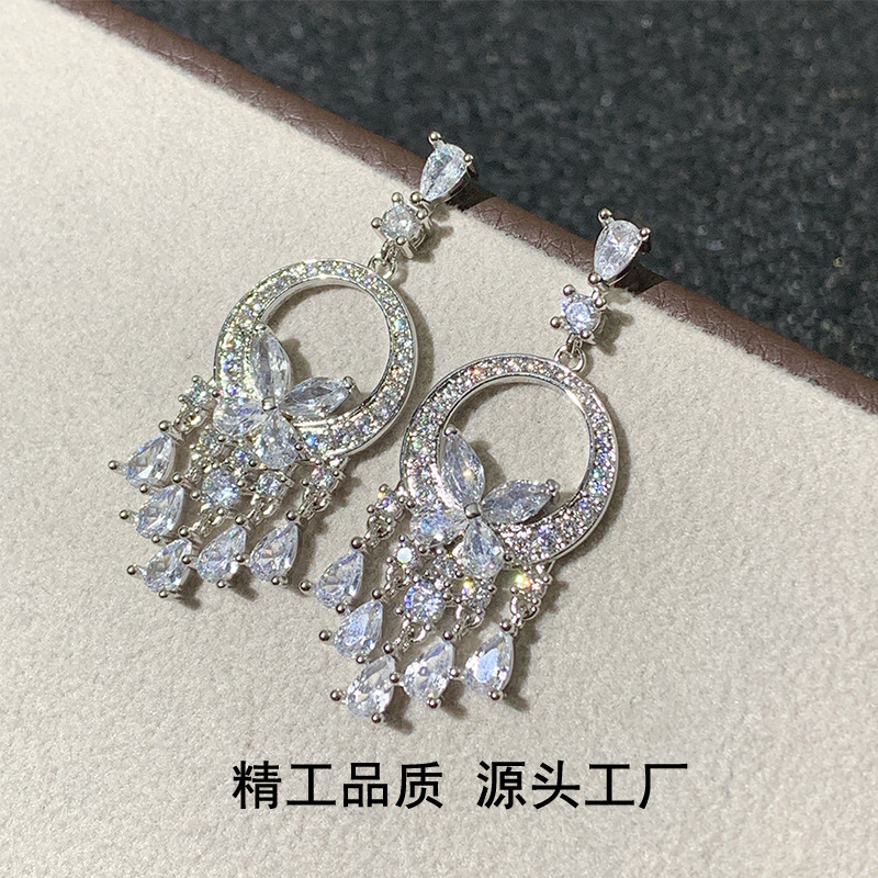 Three dimensional fashionable earrings with bow with tassels