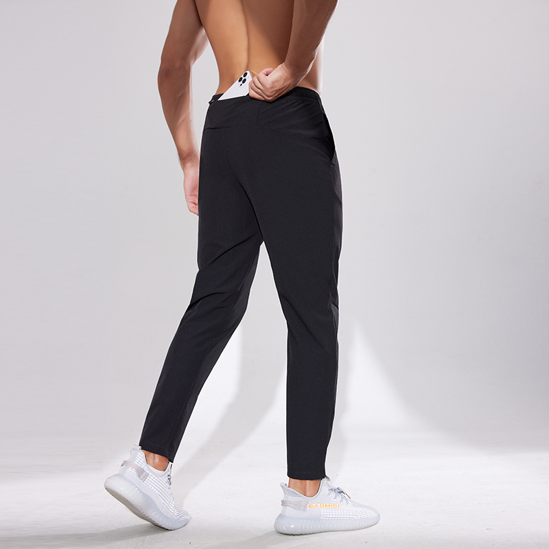 Pantalones deportivos al aire libre Otoño e Invierno hombres corriendo fitness pantalones de secado rápido sueltos transpirables deportes casuales pantalones de entrenamiento de secado rápido