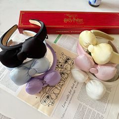 甘い蝶結びのカチューシャの少女の純色の高級感のサテンの顔はかわいい王女の団子の頭の飾りの髪飾りの女性を合わせます。