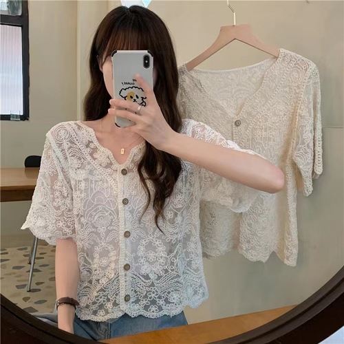 A lightweight summer shawl-style dress with spaghetti straps, paired with a lace open sweater for a fairy-like effect. It's a super fairy-like top and provides great sun protection.