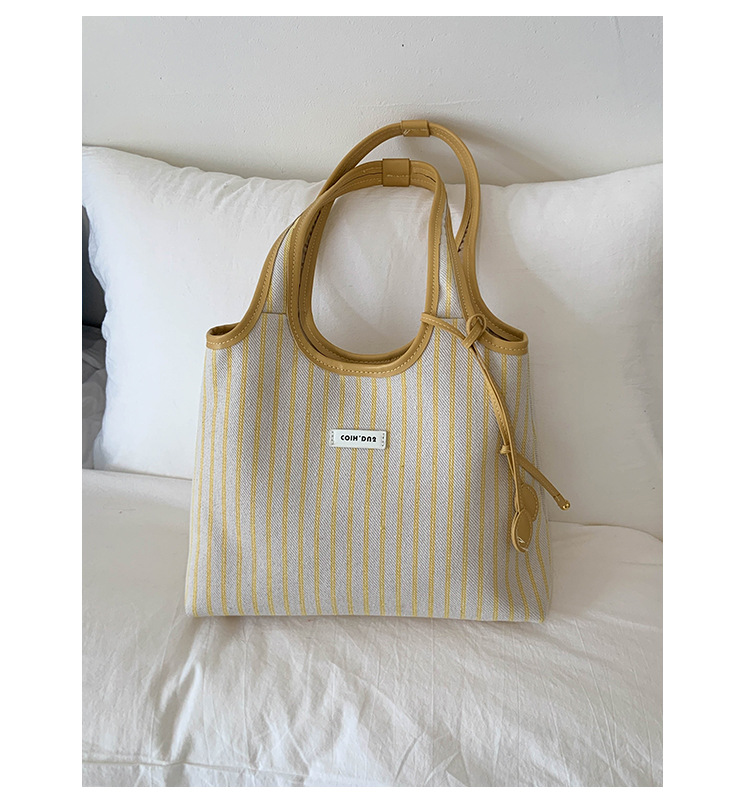 2025 Casual Commuter Tote bag, women's niche striped simple and fashionable hand-held shoulder bag, large-capacity underarm bag undefined