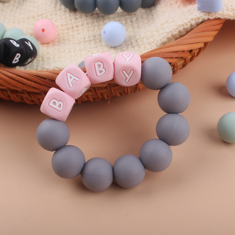 Nuevo bebé suministros mordedor pulsera creativa DIY nombre colorido de silicona letras mordedura juguete