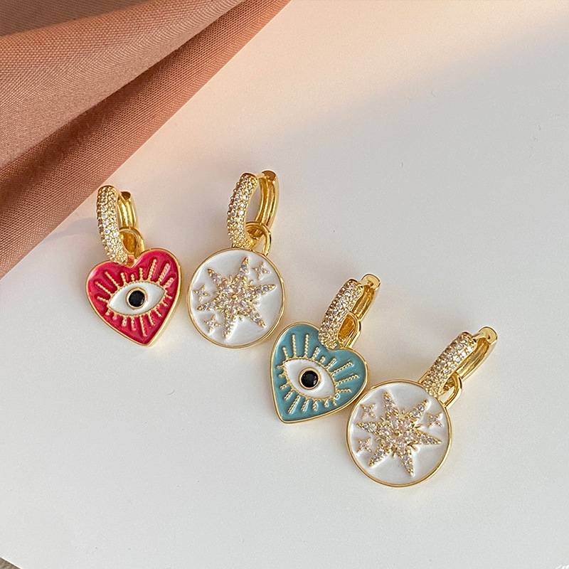 New fashion high sense design earrings earrings super flash Europe and the United States devil's eyes asymmetric painting oil stars personality