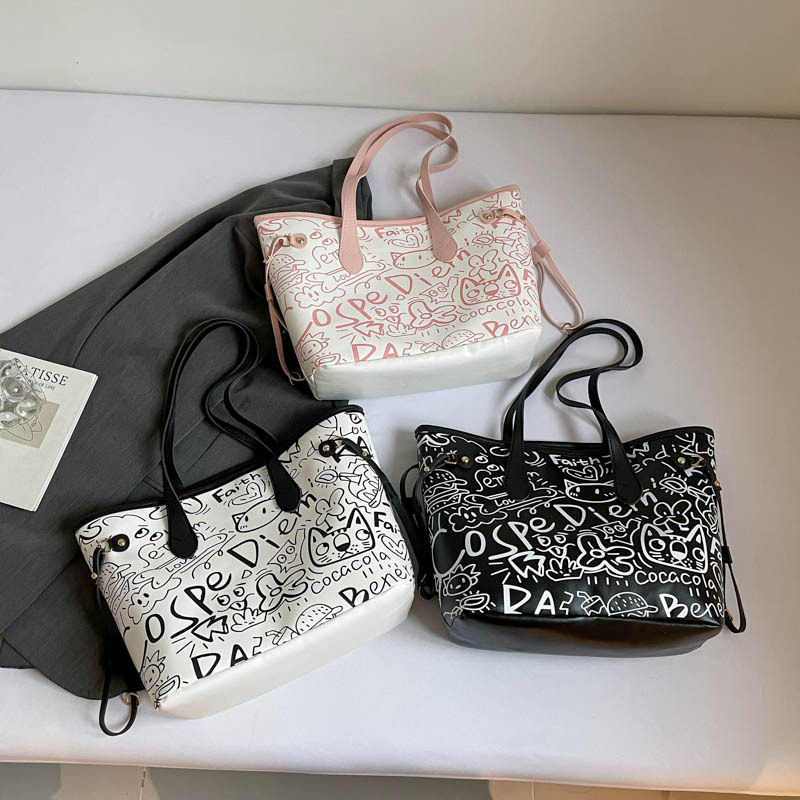 Nicho de diseño de graffiti bolso para mujeres 2025, nuevo bolso de hombro de mano casual, bolso de brazo de viaje de gran capacidad