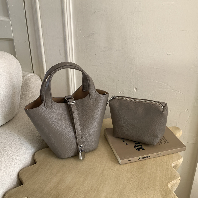 Cestas clásicas de platos bolsas de cubo de mano nicho coreano de litchi de textura alta moda versátil bolso de mochila
