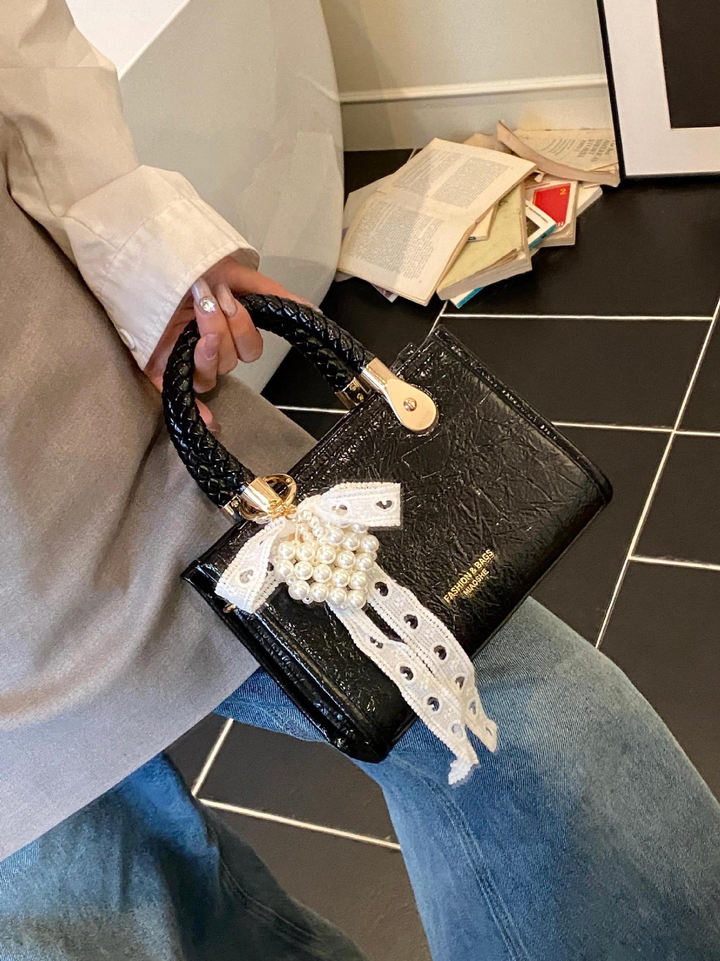 Bolso cuadrado pequeño portátil más vendido transfronterizo para mujer 2025 nuevo bolso de hombro de moda de nicho bolso de mensajero de alta gama