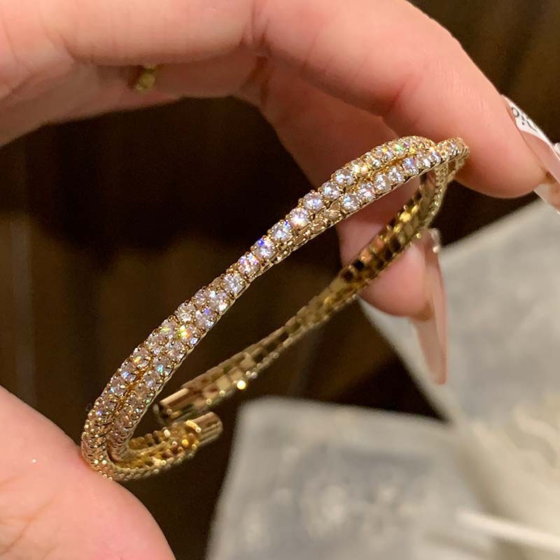 Golden bracelet with zircon
