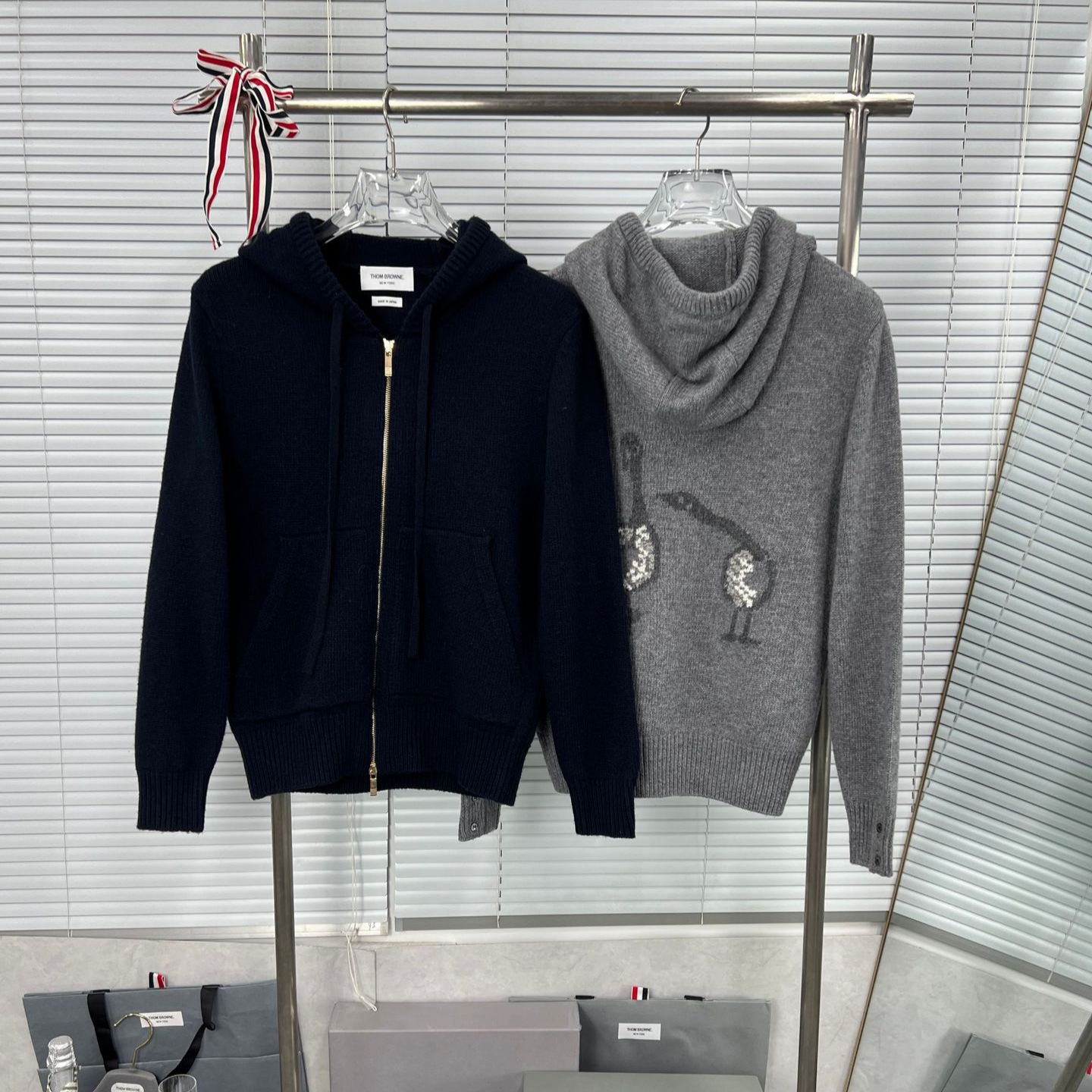 Factory direct sales of high-quality new spring and autumn long-sleeved knitted wool coats with a wild goose pattern on the back, suitable for both men and women.