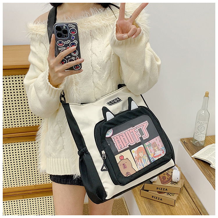 The new cute cartoon printed student bag with a large capacity and transparent student storage single-shoulder bag is selling well for women undefined