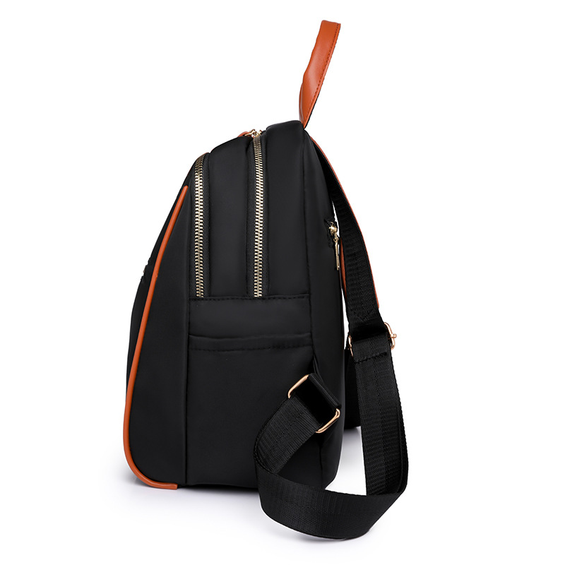 Mochila portátil para mujer 2024 nuevo estilo nylon fuera de viaje mochila simple bolsa de escuela de estudiante de gran capacidad al por mayor