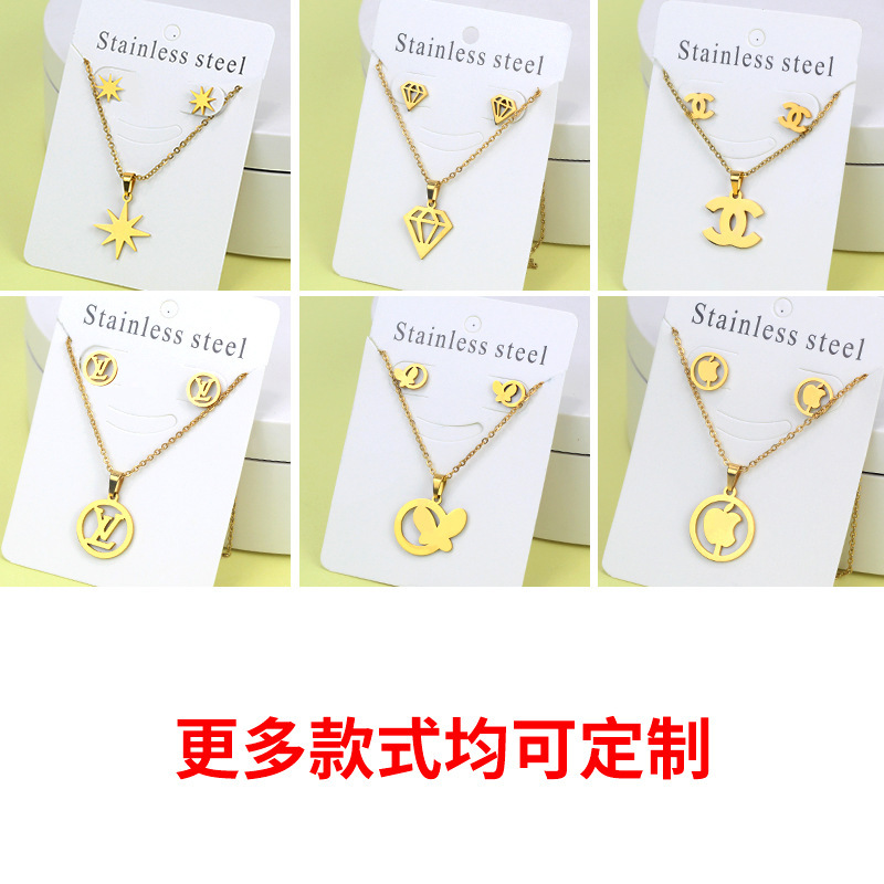 Conjunto de collar de pendientes de oro de acero inoxidable europeo y americano, collar de mariposa de amor de diamante, colgante, cadena de clavícula, fábrica al por mayor