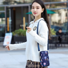 携帯電話バッグ軽量ショルダーバッグ女性2025新型ママバッグオックスフォードシンプル百合ナイロンズック小バッグ