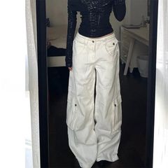 白い工装のアメリカのレトロなジーパンの女性2025の新型のギャルはゆったりしていて腰が高くて痩せています。