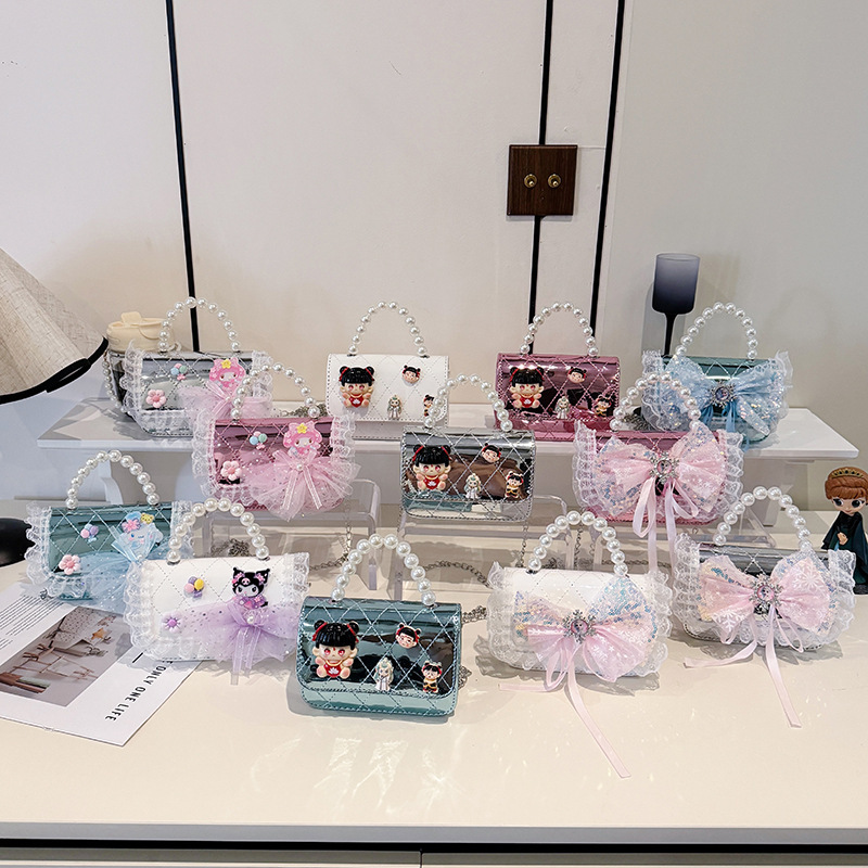 2025 nuevo niño pequeño viento mochila de hombro pequeña niña espejo princesa bolso de perla bolso de dibujos animados