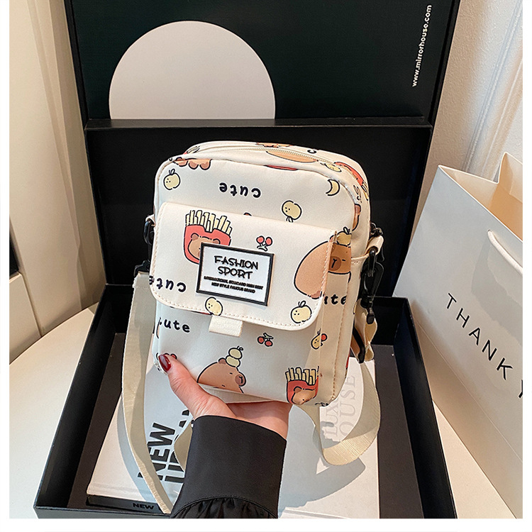 Cartoon animal print, many pockets, few bags, single-shoulder bag for girls, large capacity, cute graffiti, lightweight schoolbag for primary and middle school students undefined