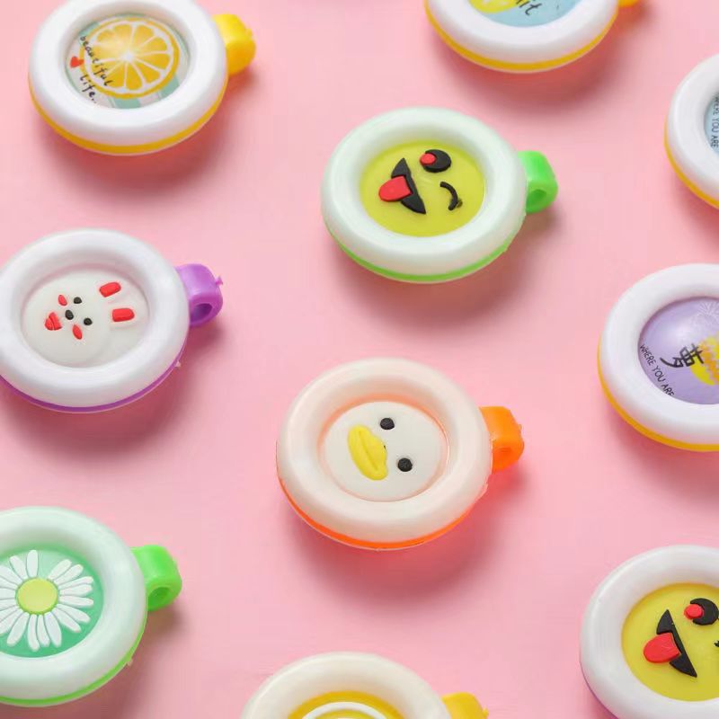 Fábrica directa de dibujos animados para niños viajes al aire libre botón de protección para bebés juguetes embarazadas perfumados botón de cuerpo sólido