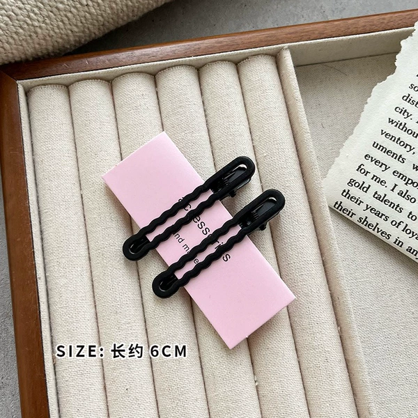 Wavy black hairgrip, cards