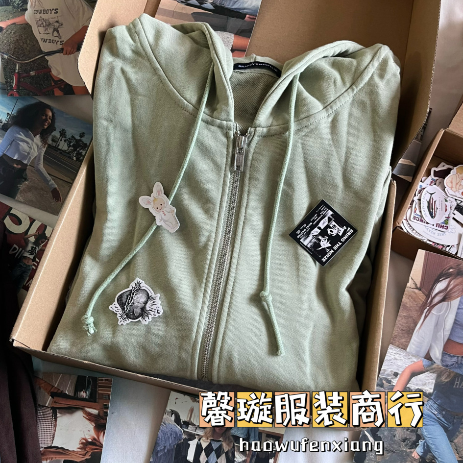 Bm風ブランディ同タイプの女性コートの純色のゆったりしたジッパーと帽子のカーディガン