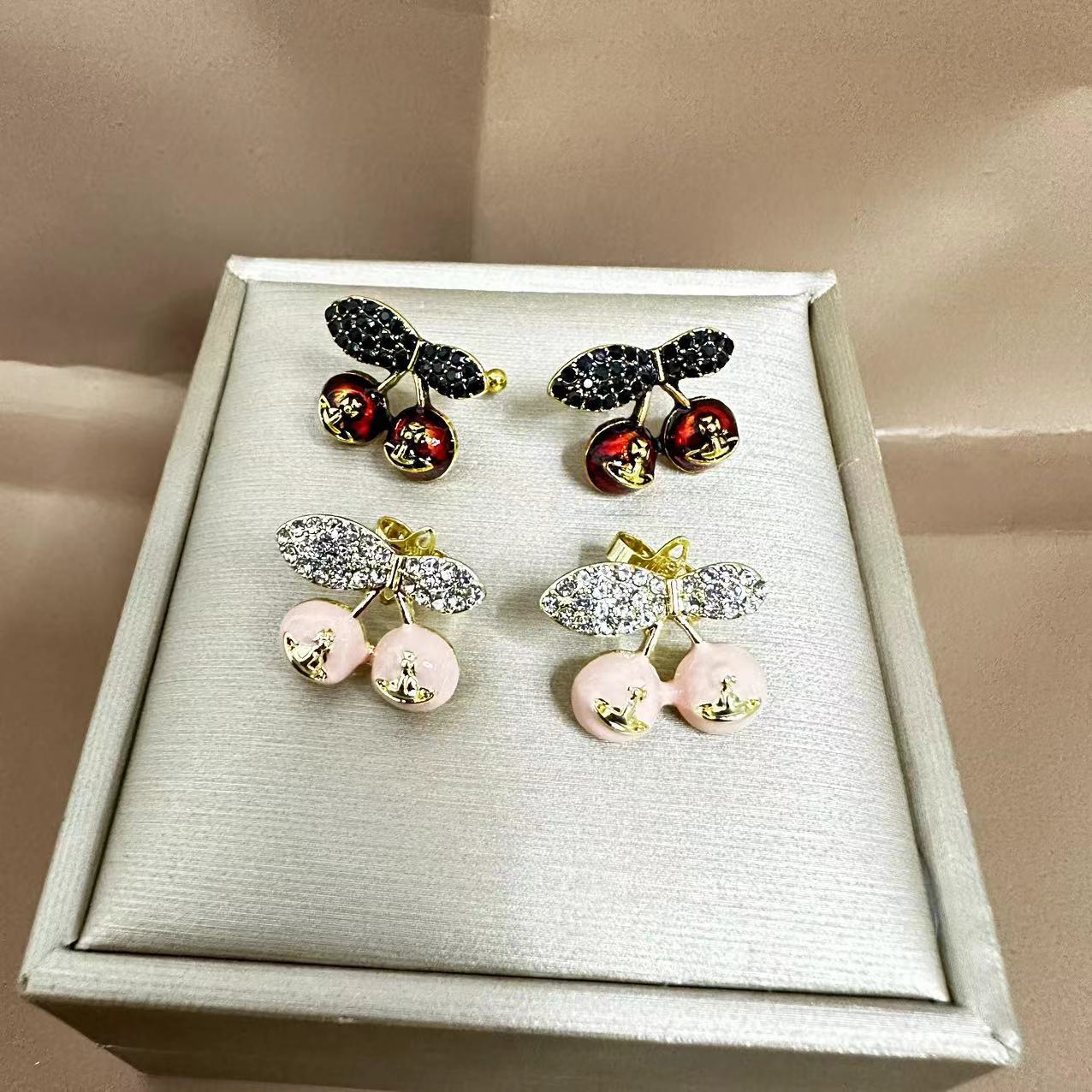 Vintage-inspired, distressed full-diamond Saturn & Cherry stud earrings for women—unique, trendy, and effortlessly versatile ear accessories with a chic ear cuff design.