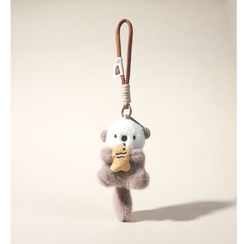 Nuevo lindo pescado nutria de peluche boutique llavero mochila colgante máquina de muñeca marina regalo pareja