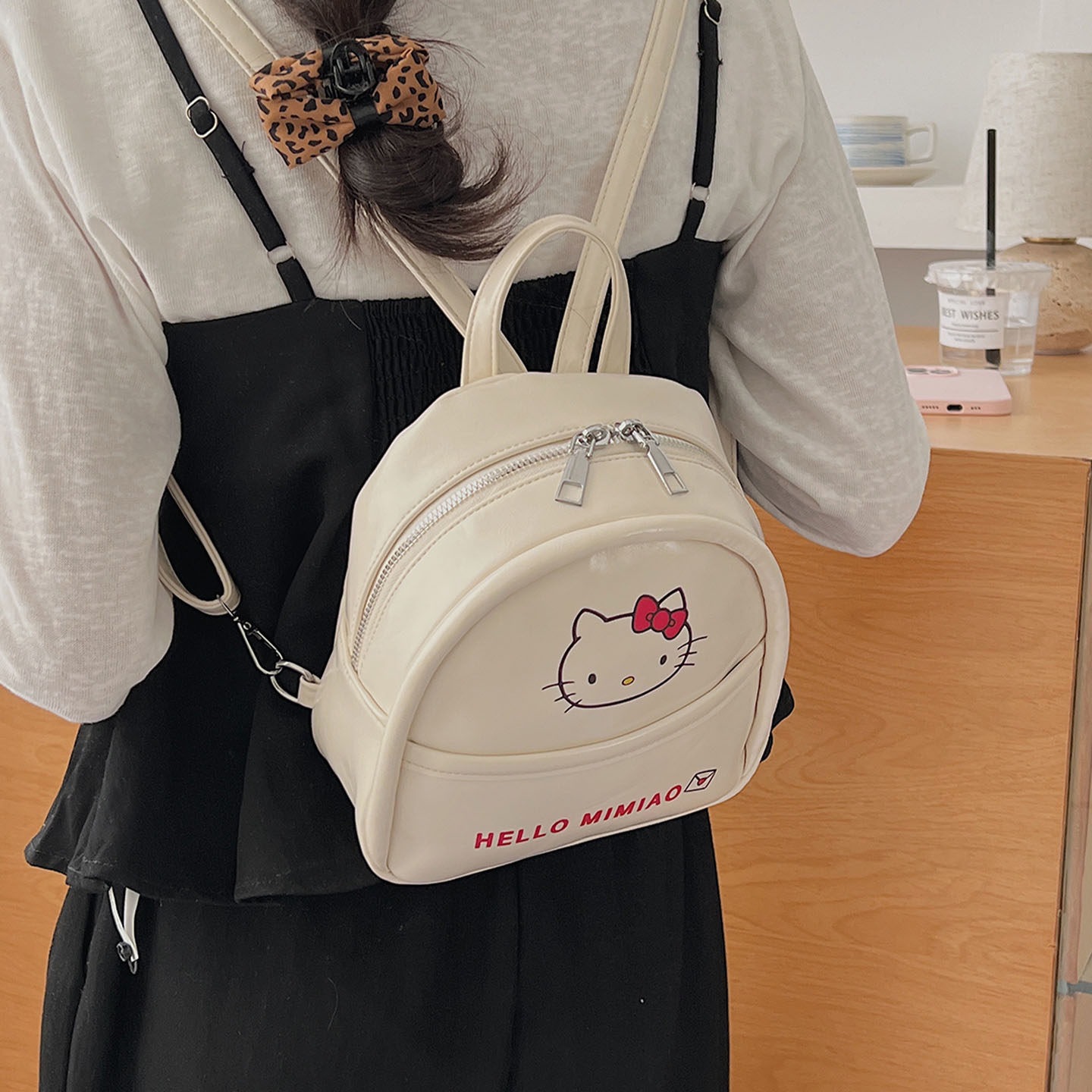 Mochila de moda encantadora mochila de clase de viento mujer de viaje temperamento universal gato 2026 mini niña nueva