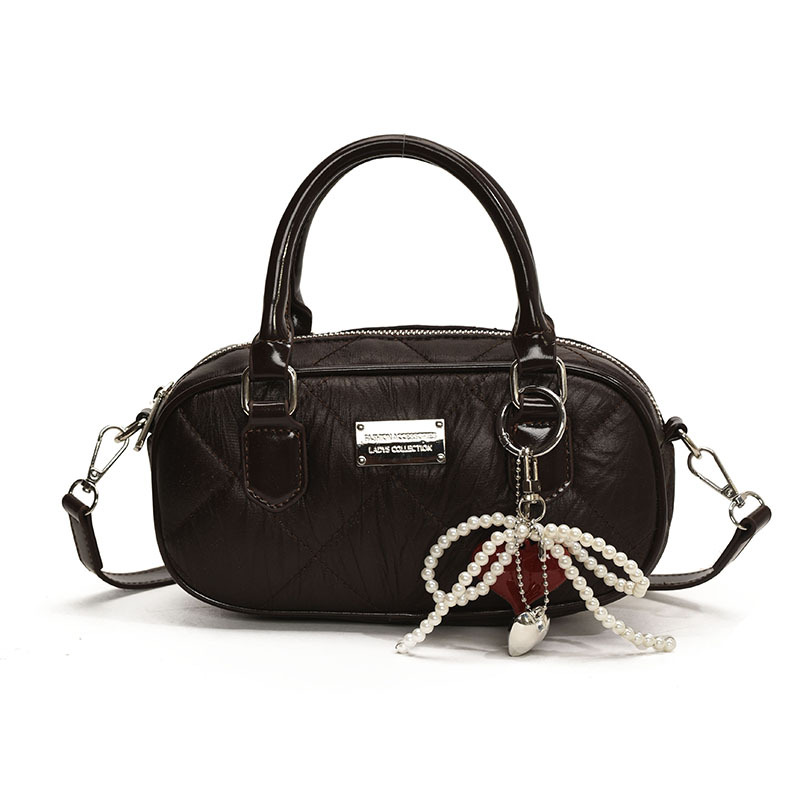 Bolsa de bolos de mano popular de este año para mujeres 2025, nueva bolsa de hombro de tendencia universal de alta calidad, bolso cuadrado de estilo extranjero