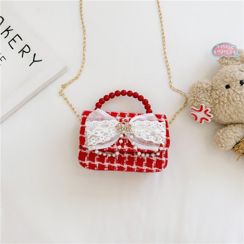 2024 nueva moda lindas bolsas de hombro para niños bolsas de perlas a cuadrícula bolsas extranjeras bolsas de hombro para niñas gran capacidad marea