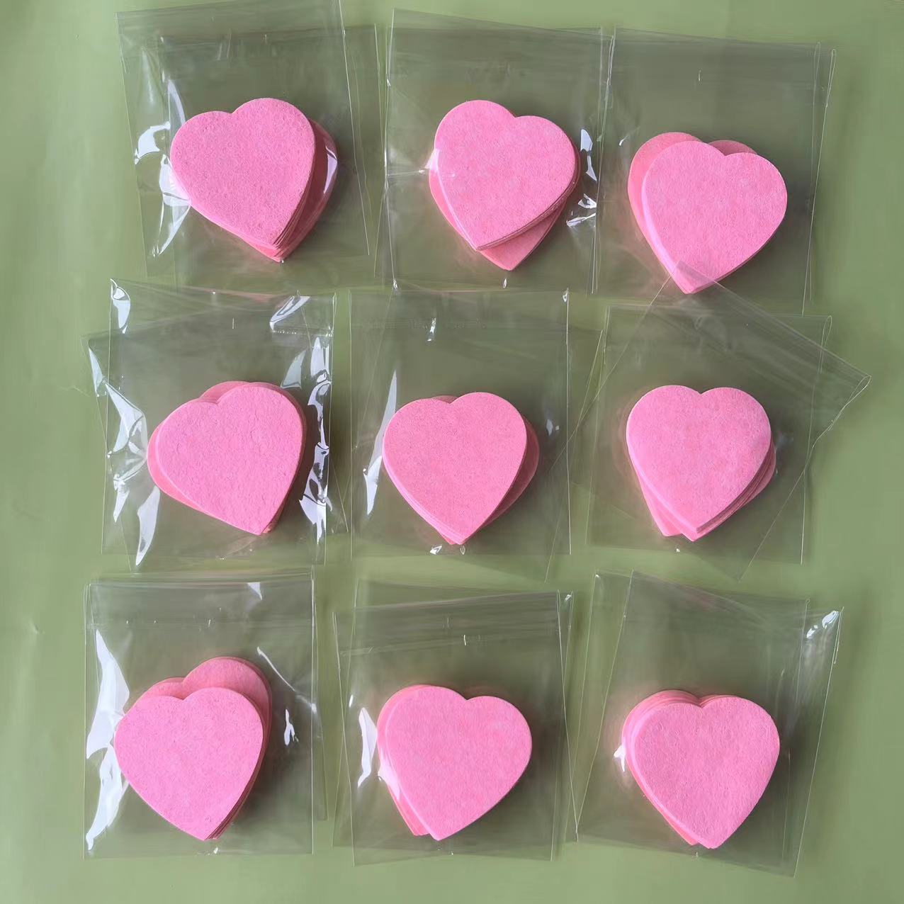 Transfronteriza Venta caliente amor en forma de corazón comprimido de pulpa de madera de algodón cara de lavado puff belleza removedor de maquillaje esponja de limpieza puff salon SP Limpieza de algodón