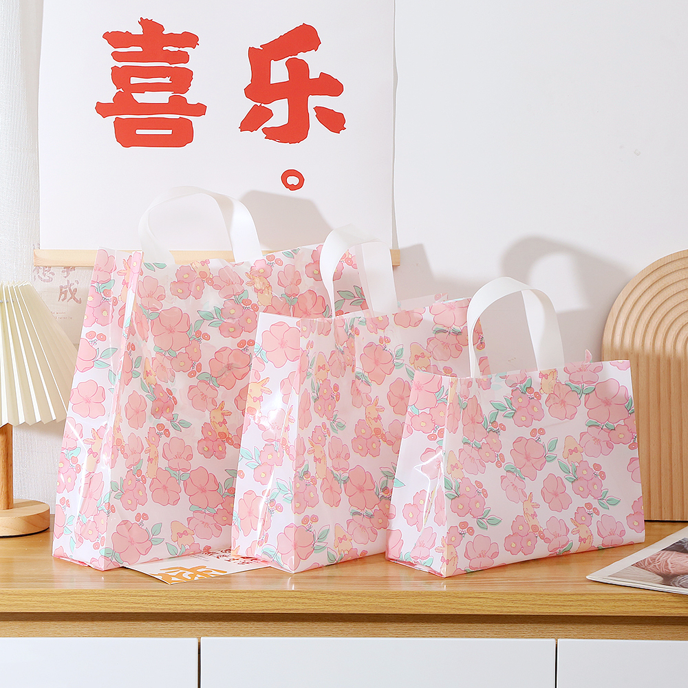 Bolsas de regalo de plástico personalizadas impresión logotipo bolsas de ropa personalizadas bolsas de goma de compras ropa de mujer portátil