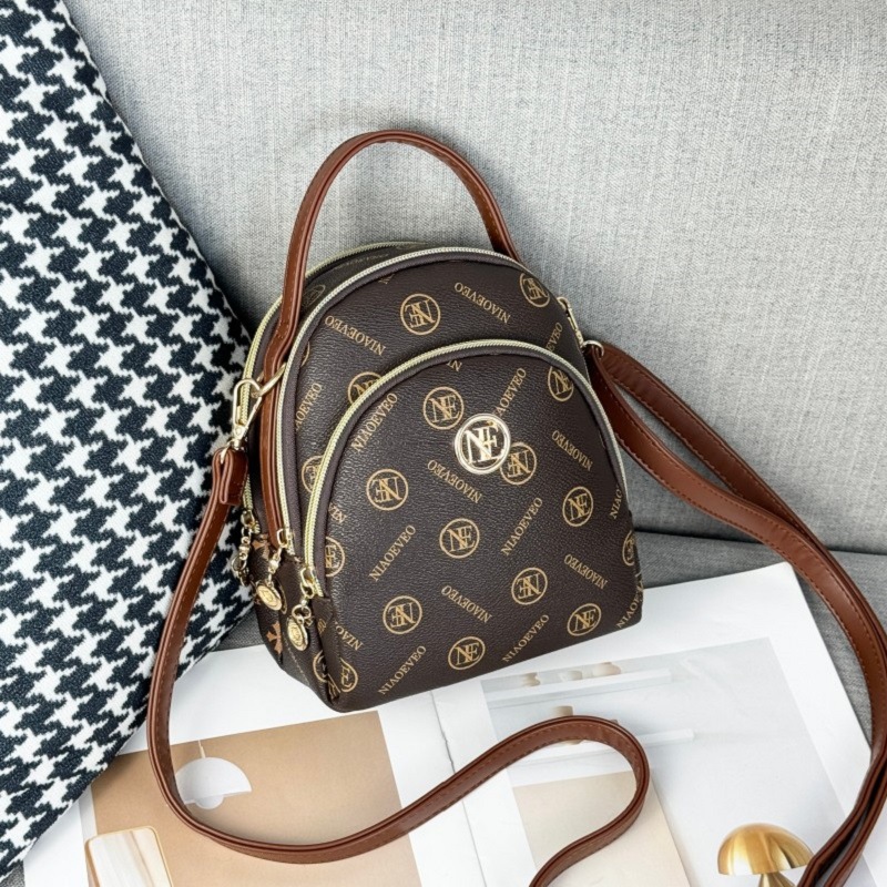 Guangzhou Hengli 2024 nueva moda mochila pequeña bolso de mano bolso de teléfono móvil madre de mediana edad bolso de mensajero de tres usar