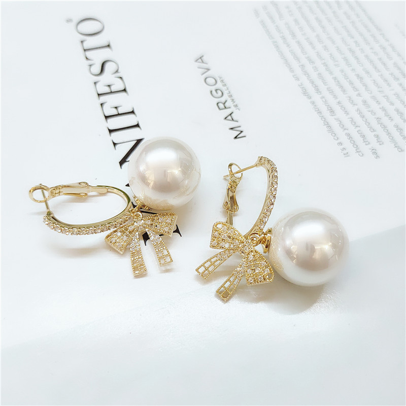 Fashion Pearl Bow Earrings display picture 5