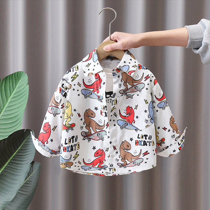 7751 Camisa de primavera para niños Camisa de manga larga con estampado de dinosaurio de dibujos animados para niños Primavera y otoño Tops atractivos de moda Primavera