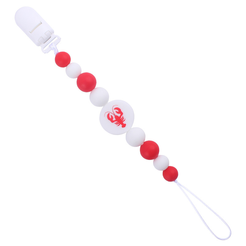 Nuevo bebé suministros de dibujos animados de impresión redonda amor creativo DIY silicona mordedura molar pezón cadena anti-caída