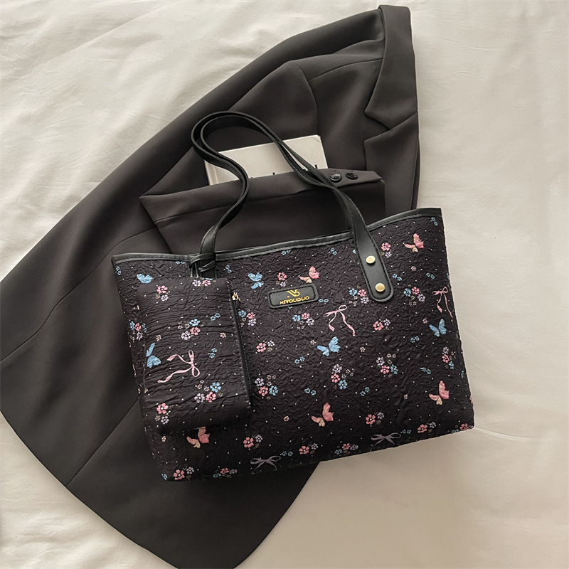 2026 flores coreanas mariposas de gran capacidad de viaje de primavera nueva moda moda extranjera bolso de hombro