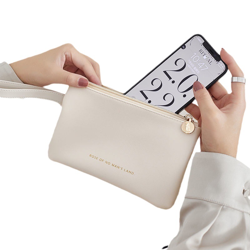 Bolsa de teléfono móvil para mujeres 2023 nuevo cuero ligero portátil de alto grado Mini bolsa de cosméticos de almacenamiento pequeño impermeable